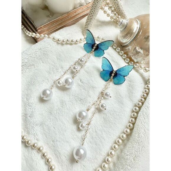 Bright blue butterfly earrings with faux pearl dangle ￼ - Picture 1 of 5